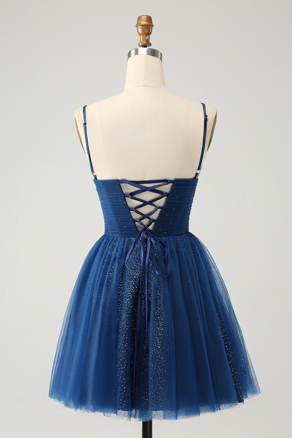 Vestido de cóctel azul marino con tirantes finos y espalda con cordones de tul