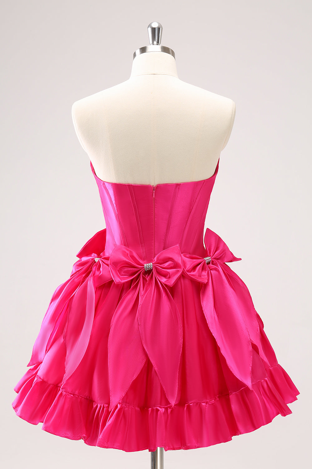 Vestido de fiesta corto de corte A con corsé sin tirantes y lazos en color fucsia