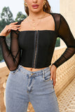 Top corsé negro con mangas largas transparentes