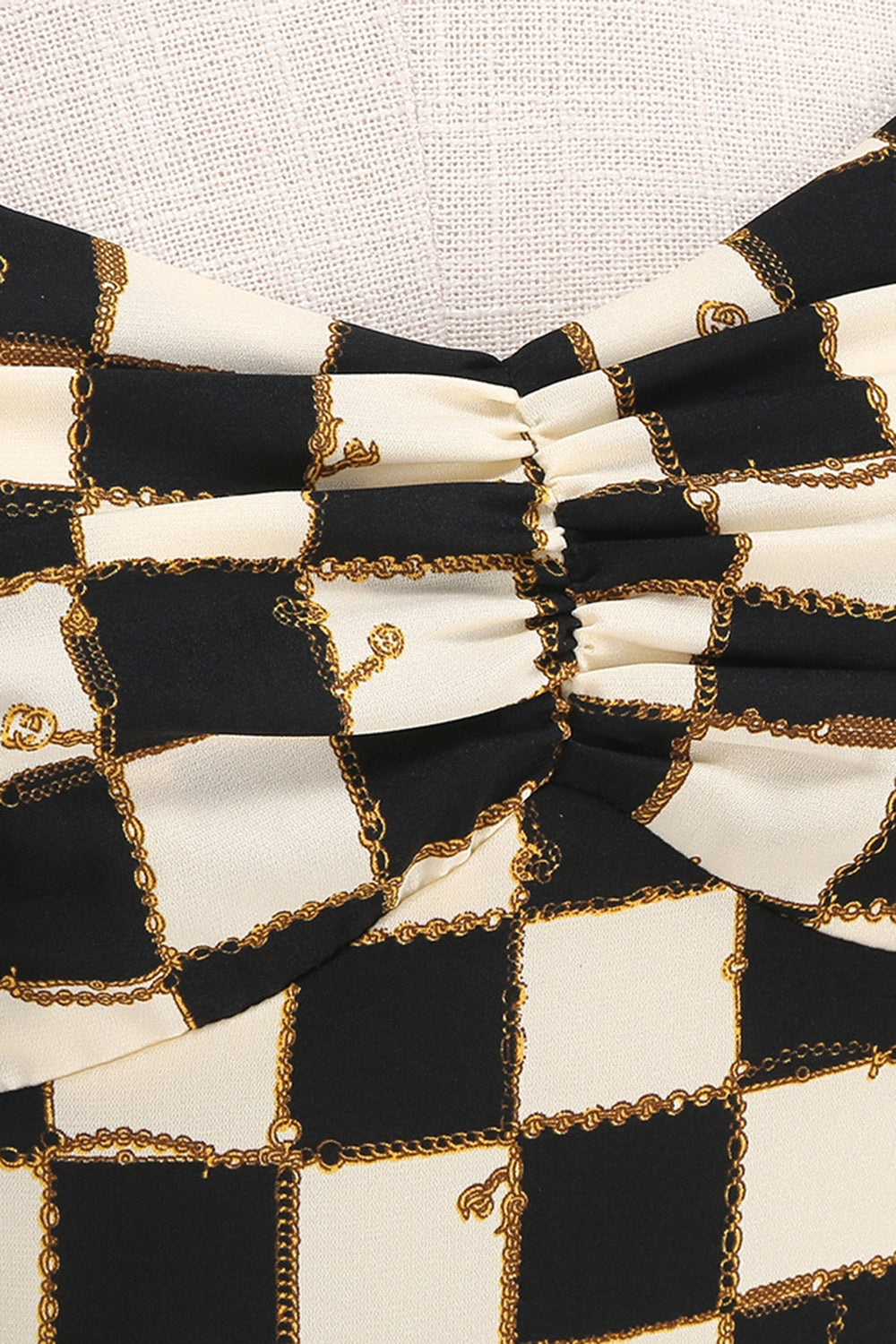 Vestido corto halter a cuadros de rejilla negra de la década de 1950