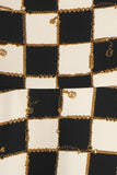Vestido corto halter a cuadros de rejilla negra de la década de 1950