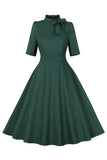 Vestido vintage de la década de 1950 con cuello alto verde oscuro