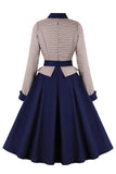Vestido de manga larga con cinturón azul marino de la década de 1950