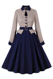 Vestido de manga larga con cinturón azul marino de la década de 1950