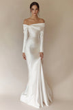 Vestido de novia sirena blanco con hombros descubiertos y manga larga