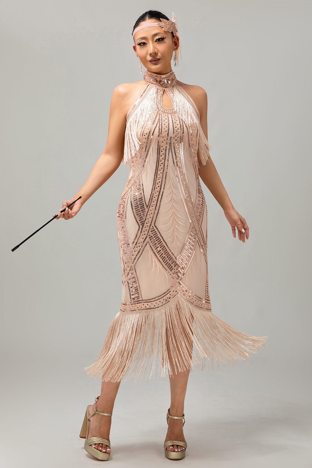 Vestido de lentejuelas con flecos y ojales de champán de los años 20