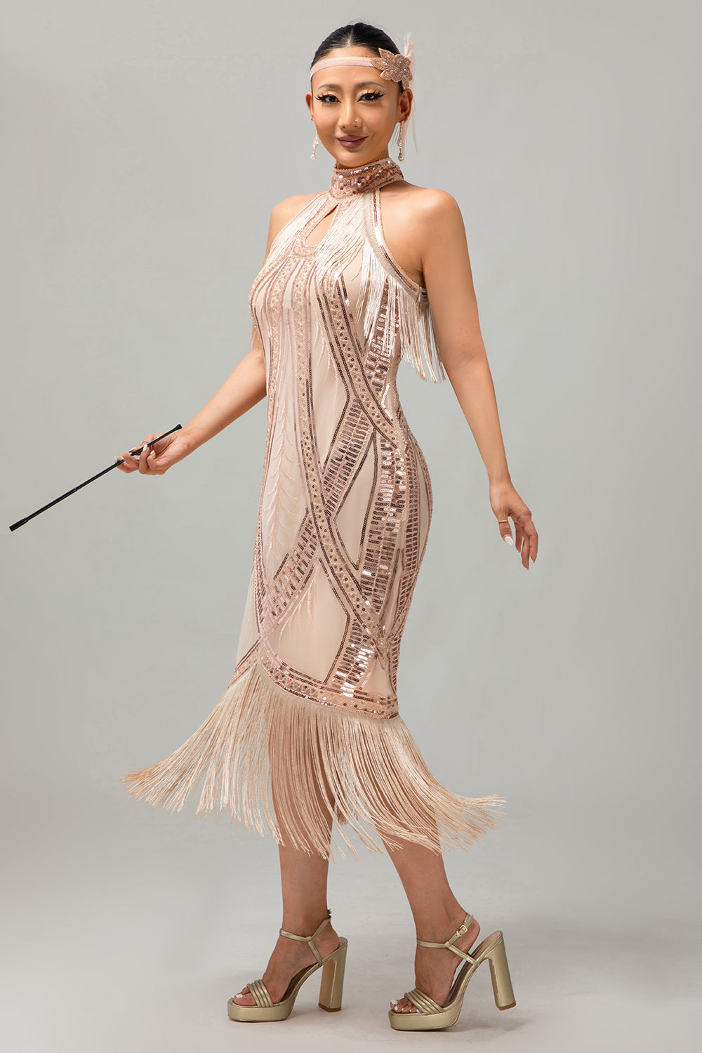 Vestido de lentejuelas con flecos y ojales de champán de los años 20