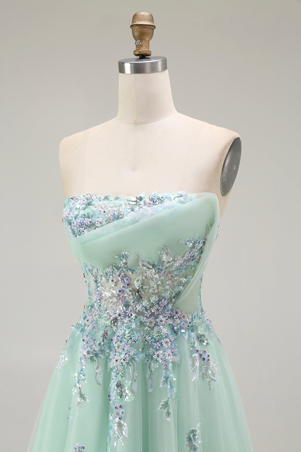 Vestido largo de fiesta con corsé transparente de tul sin tirantes verde con apliques