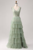 Vestido de fiesta verde plisado escalonado con abertura