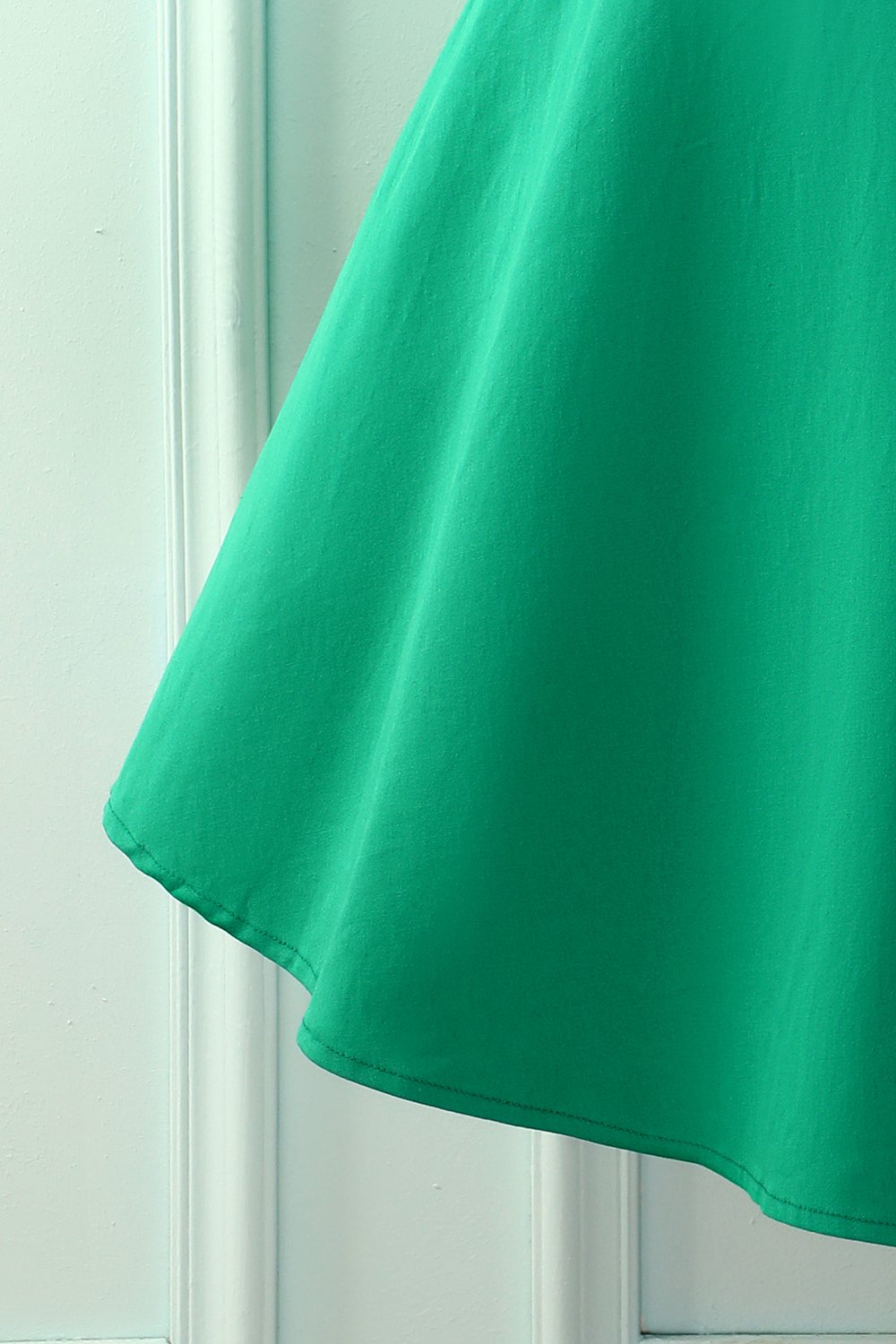 Vestido con cuello barco verde de los años 50