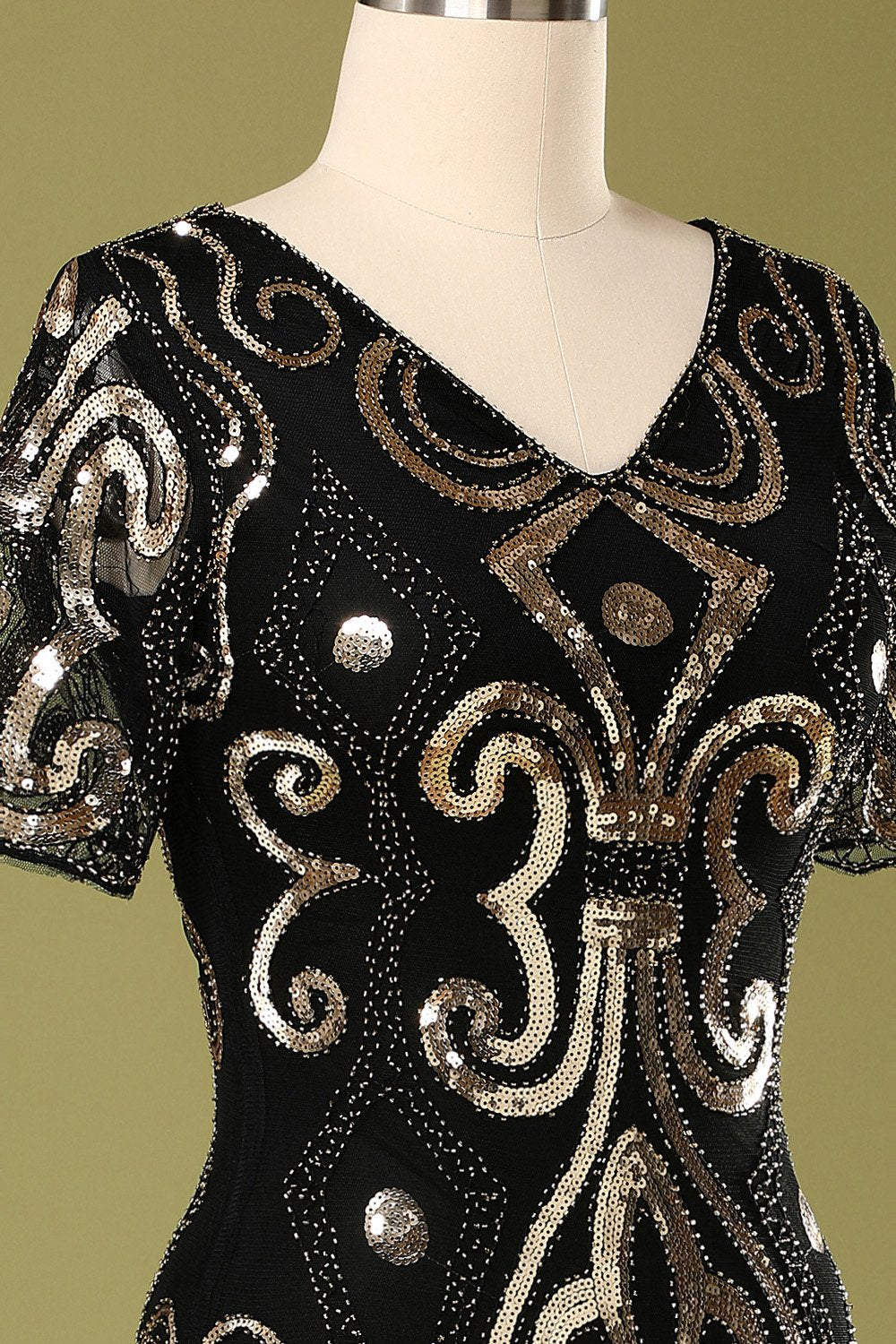 Vestido de aleta de lentejuelas negras de los años 20