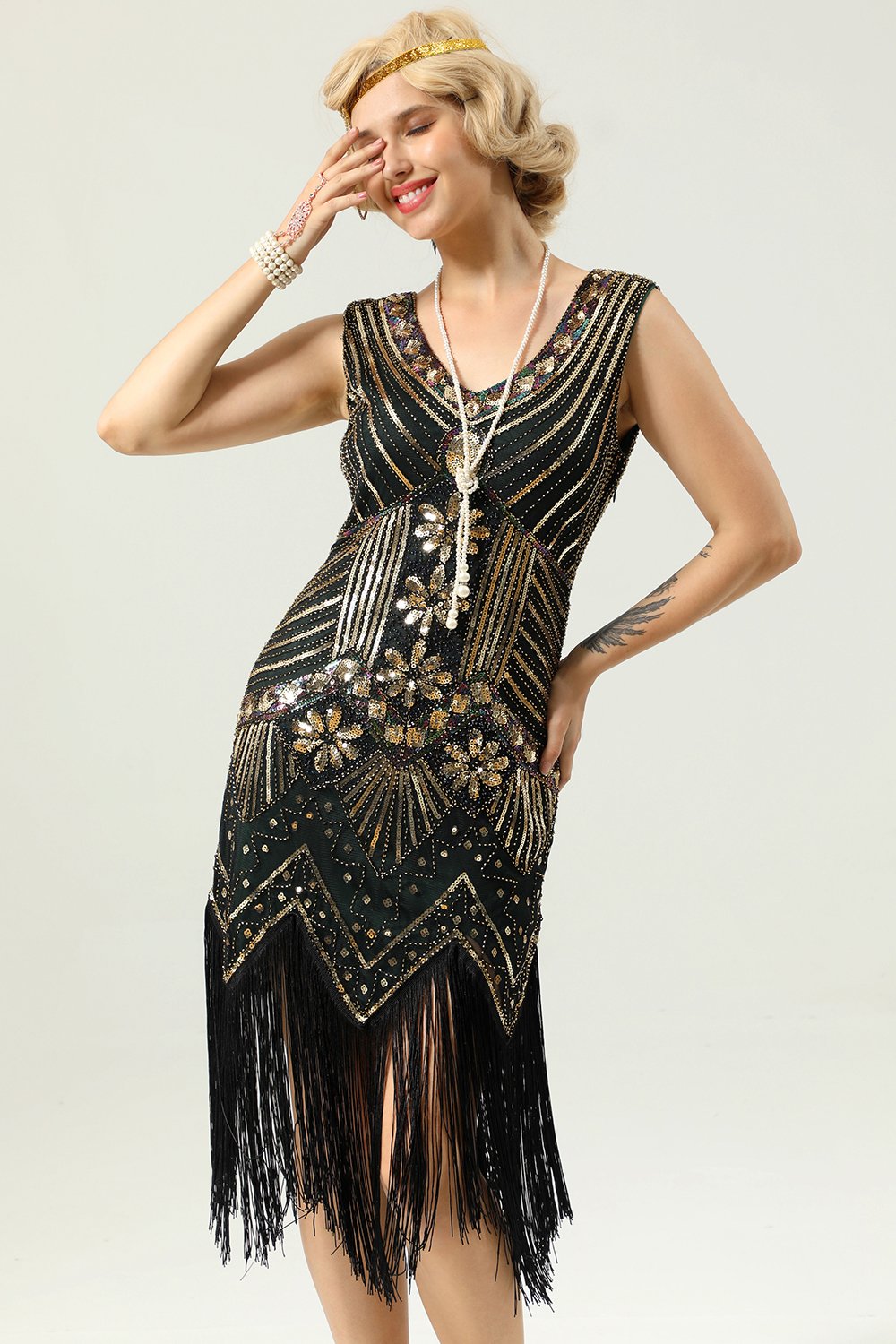 Vestido de lentejuelas negras y doradas de la década de 1920