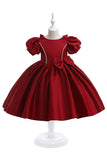 Vestido de niña de satén burdeos con lazo
