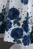 Una línea de cuello joya azul estampado vestido de niña