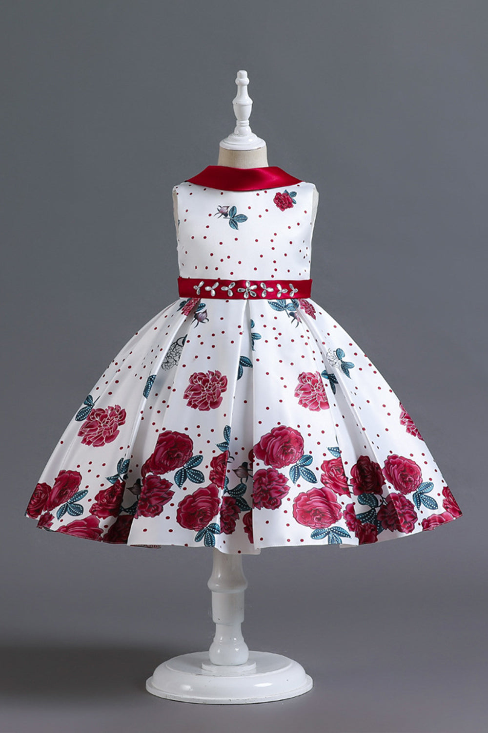 Una línea de cuello joya azul estampado vestido de niña