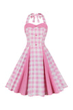 Un vestido rosa a cuadros rosa a cuadros de la década de 1950 con cuello halter