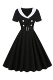 Vestido swing negro de la década de 1950 con cinturón