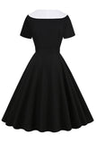 Vestido swing negro de la década de 1950 con cinturón