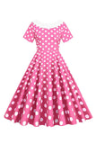 Cuello de barco de lunares rosa Vestido de la década de 1950 con moño