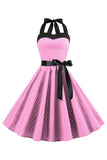 Vestido de lunares rosas halter de la década de 1950 con moño