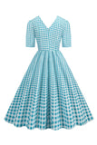 Vestido negro con cuello en V con cuello en V de la década de 1950