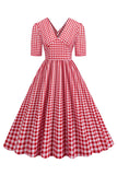 Vestido negro con cuello en V con cuello en V de la década de 1950