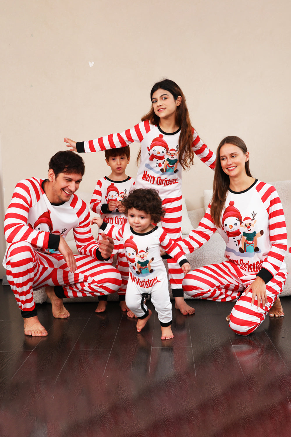 Juego de pijamas familiares navideños de muñecos de nieve de rayas rojas