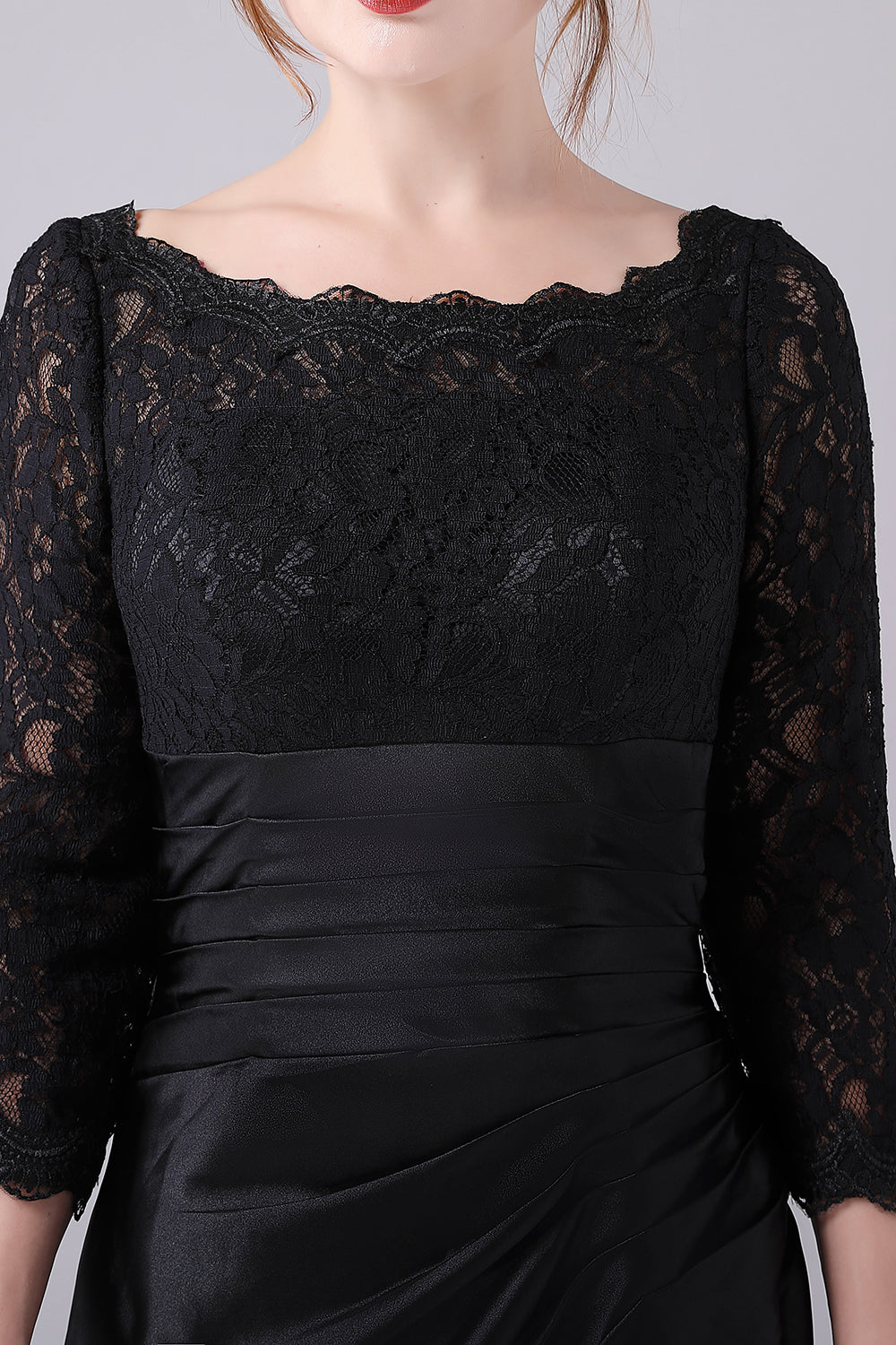 Vestido negro de manga larga con cuello barco de línea A