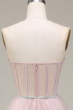 Vestido de fiesta rosa claro de tul con corsé
