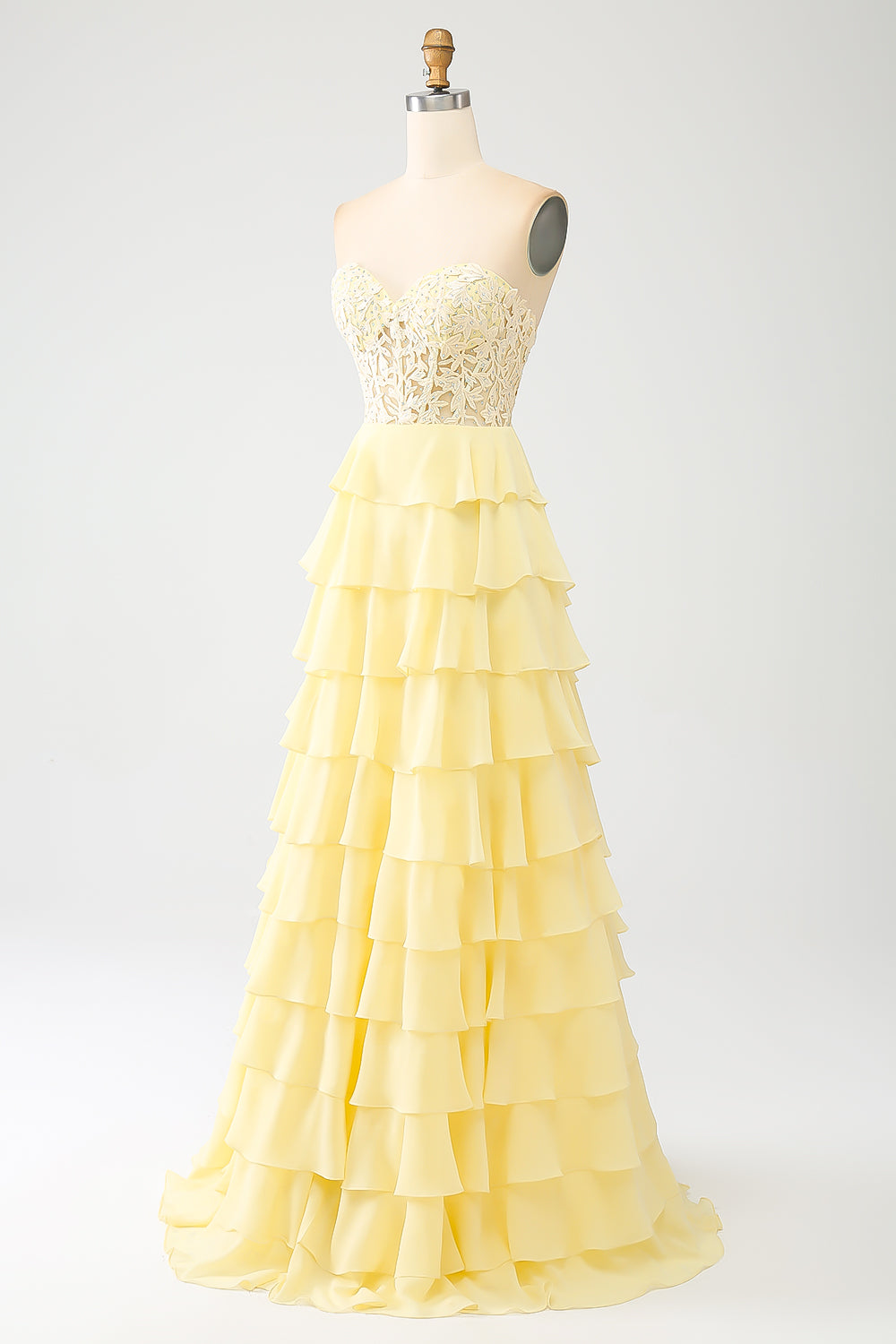 Vestido de fiesta amarillo con niveles de novia