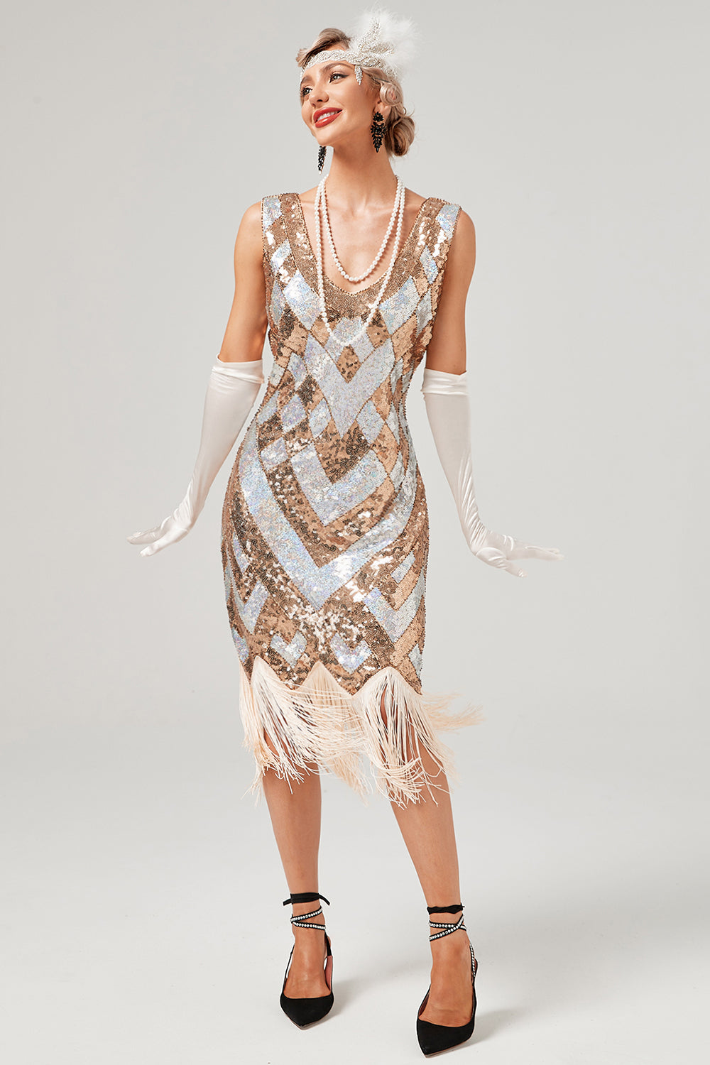 Vestido de lentejuelas doradas de la década de 1920 con flecos