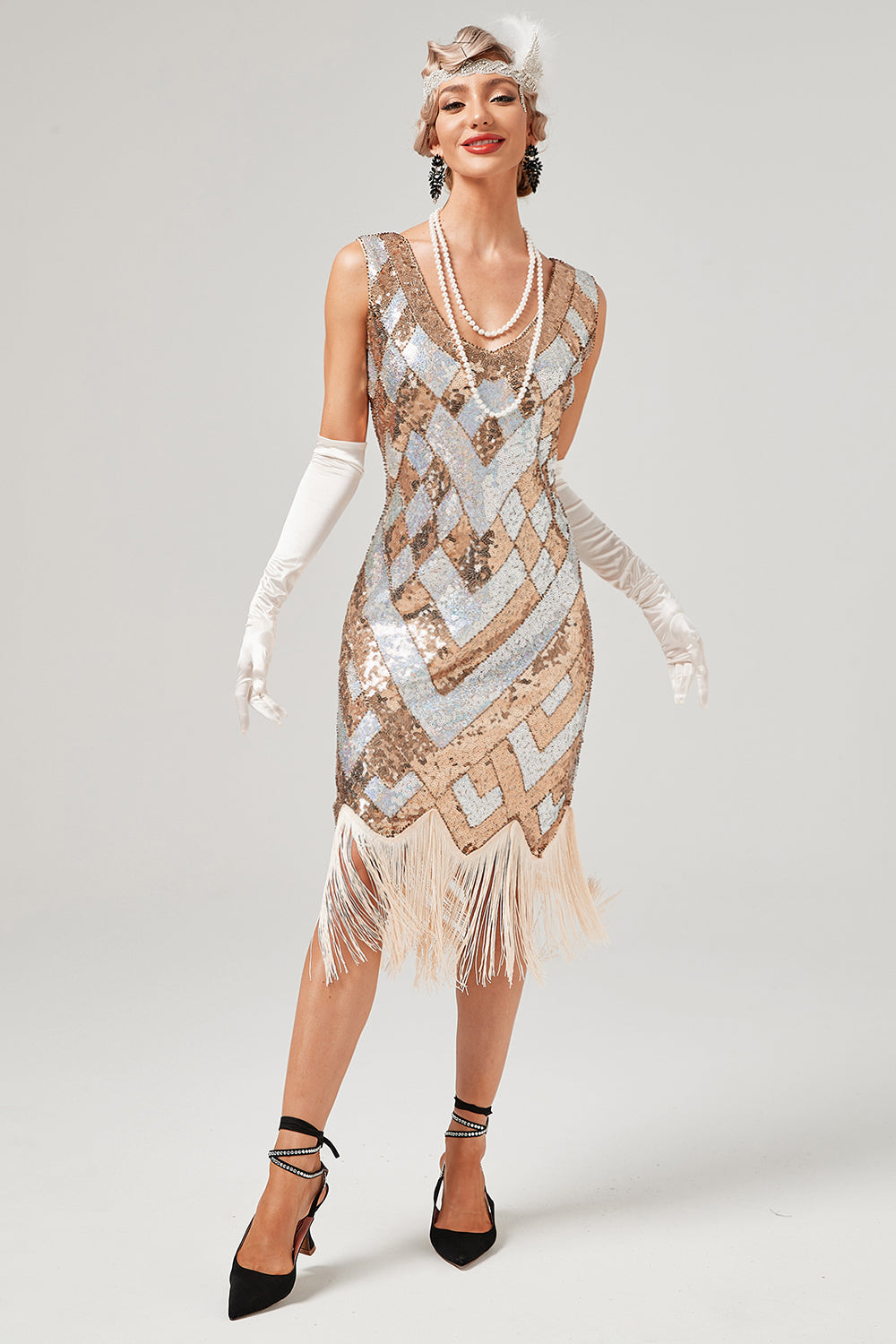 Vestido de lentejuelas doradas de la década de 1920 con flecos