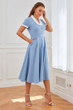 Vestido swing azul de la década de 1950 con bolsillos