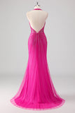 Vestido largo de fiesta con cuentas y espalda abierta de sirena fucsia con abertura