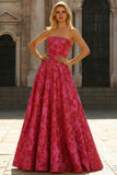 Vestido largo de graduación de brocado floral fucsia en línea A sin tirantes