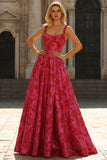 Vestido largo de graduación floral Línea A en fucsia con tirantes finos de brocado jacquard