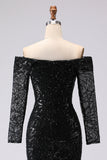 Vestido formal negro de malla y encaje con funda negra y manga larga