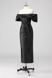 Vestido formal negro con hombros descubiertos y abalorios