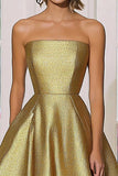Elegante vestido de gala sin tirantes de satén dorado metálico de una línea