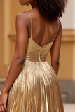 Vestido de fiesta largo con purpurina y tirantes finos dorados con abertura