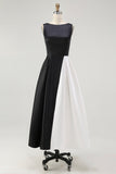 Un vestido de corbata negra de satén con cuello de barco de línea