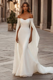 Vestido de novia sirena marfil con hombros descubiertos y mangas capa