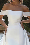 Vestido de novia marfil con hombros descubiertos alto-bajo con cola drapeada