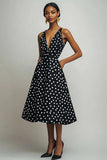 Vestido de lunares A con escote en V blanco y negro