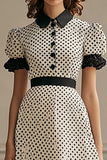 Vestido de lunares blanco negro con solapa y mangas abullonadas