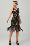 Vestido negro brillante con flecos dorados de la década de 1920