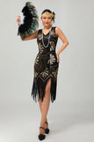 Vestido negro brillante con flecos dorados de la década de 1920