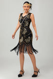 Vestido negro brillante con flecos dorados de la década de 1920