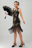 Vestido negro brillante con flecos dorados de la década de 1920