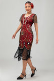 Vestido ajustado con flecos dorados y cuentas de la década de 1920